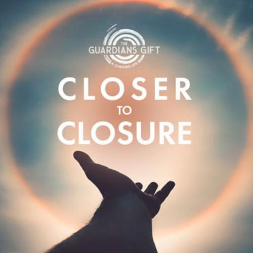 A silhouetted hand reaching out to a bright light